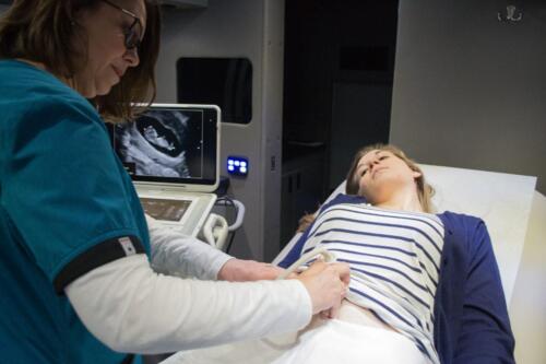 Ultrasound on board the Mobile Clinic (model is not a real client)